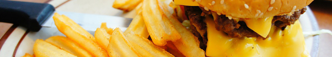 Eating Burger at Teddy's Bigger Burgers restaurant in Kailua, HI.